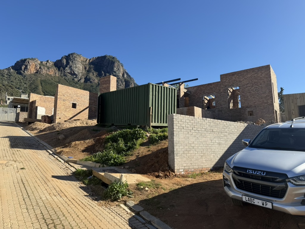 Johannesdal — brick house under construction below the mountain
